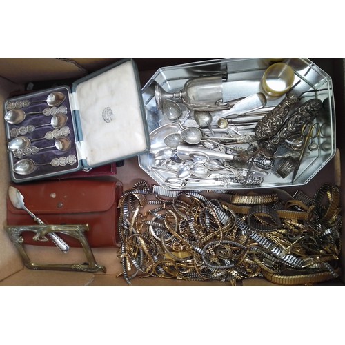 457 - A box of assorted metal ware including Chinese white metal spoons, watch straps, silver etc.