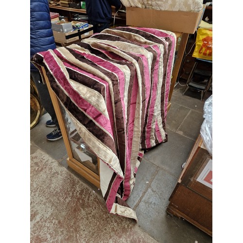 321 - A pair of heavy velvet curtains, some material suitable for upholstery & a vintage bedspread.