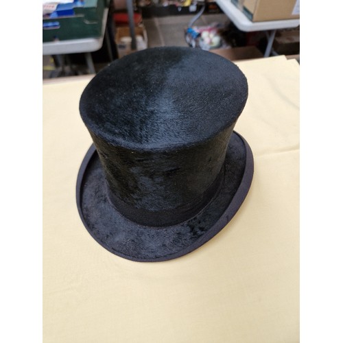 54 - An antique top hat and a bowler hat.