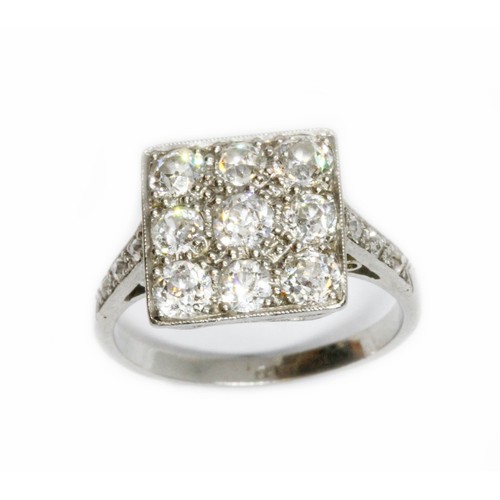 486 - An antique diamond cluster ring, nine pave set old European cut diamonds set in a square cluster mea... 