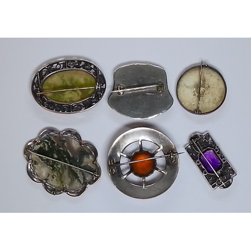 487 - A collection of six silver and white metal brooches including moss agate, Ruskin, amethyst, Scottish... 