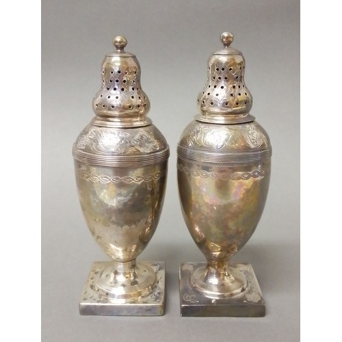 524 - A matched pair of George III silver pepper pots, one hallmarked for Andrew Fogelberg, London 1810, t... 