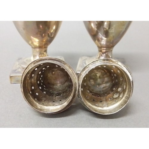 524 - A matched pair of George III silver pepper pots, one hallmarked for Andrew Fogelberg, London 1810, t... 