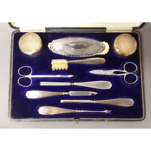 530 - A cased hallmarked silver manicure set.