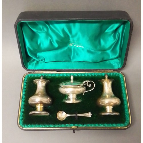 528 - A cased hallmarked silver cruet, non matching spoon, silver weight 4.3ozt.