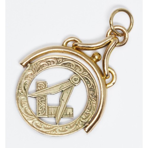 498 - A Masonic swivel pendant, marked '9ct', length 30mm, weight 3.2g.