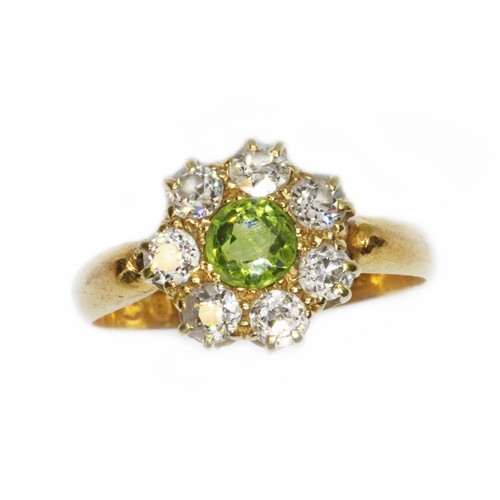 508 - A Victorian diamond and green stone cluster ring, the central stone measuring approximately 4.85mm i... 