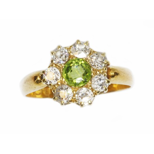 508 - A Victorian diamond and green stone cluster ring, the central stone measuring approximately 4.85mm i... 