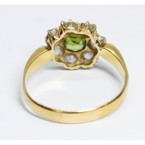 508 - A Victorian diamond and green stone cluster ring, the central stone measuring approximately 4.85mm i... 