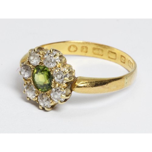 508 - A Victorian diamond and green stone cluster ring, the central stone measuring approximately 4.85mm i... 