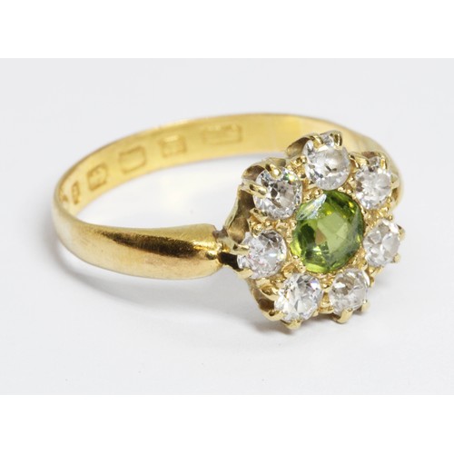 508 - A Victorian diamond and green stone cluster ring, the central stone measuring approximately 4.85mm i... 