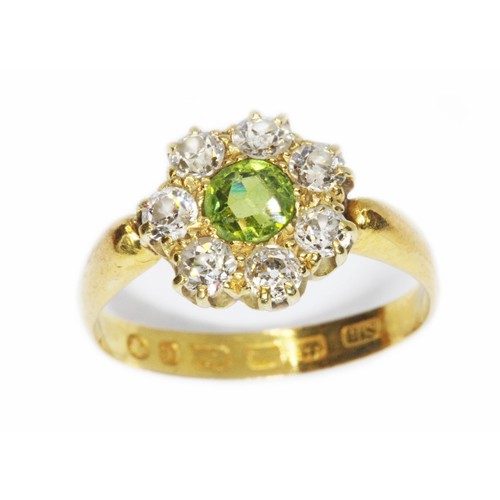 508 - A Victorian diamond and green stone cluster ring, the central stone measuring approximately 4.85mm i... 