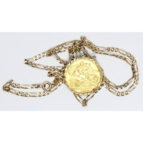 505 - A George V 1911 half sovereign, hallmarked 9ct gold pendant mount, 36cm figaro chain, 9ct gold impor... 