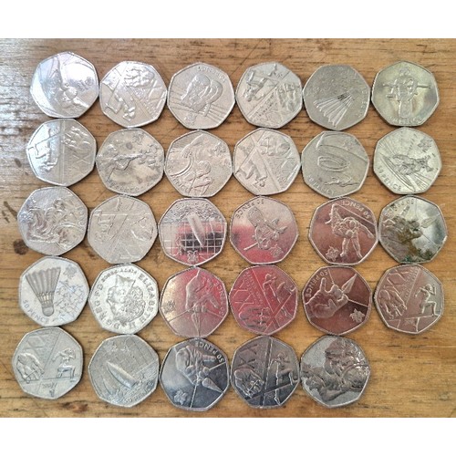 557 - A group of 29 assorted collectable 50p coins.