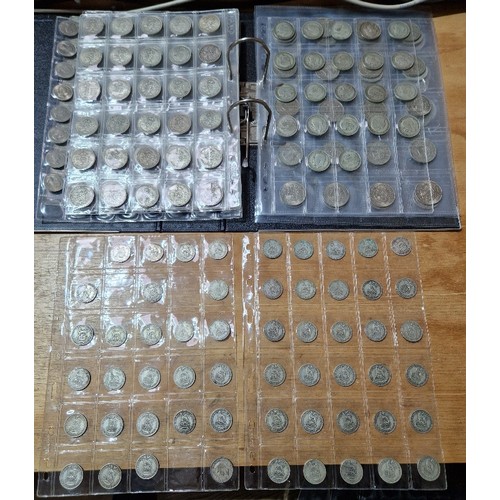 584 - A file of assorted GB coins to include silver coins etc.