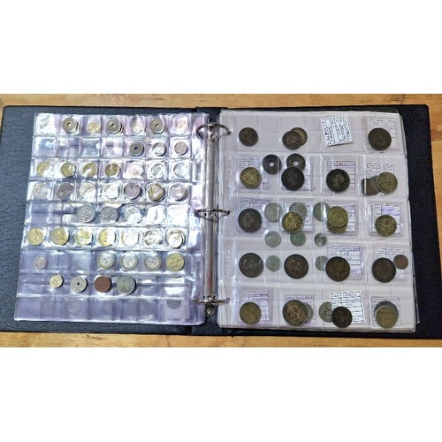 586 - An album of assorted world coins to include some silver etc.