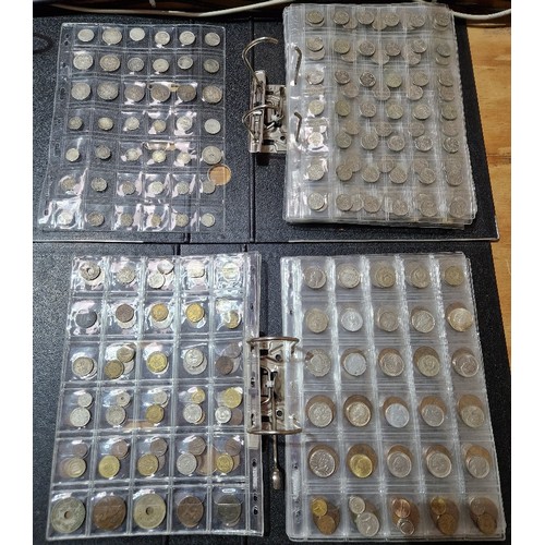 583 - Two files of assorted GB & world coins to include silver coins & threepences etc.