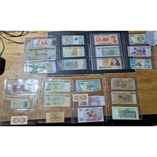 596 - A file of assorted world banknotes