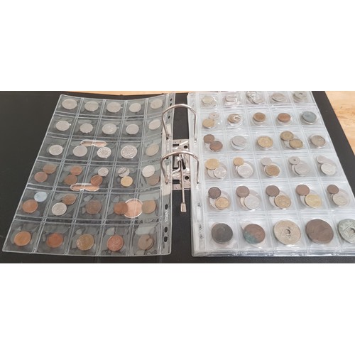 583 - Two files of assorted GB & world coins to include silver coins & threepences etc.