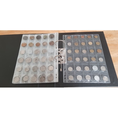 583 - Two files of assorted GB & world coins to include silver coins & threepences etc.