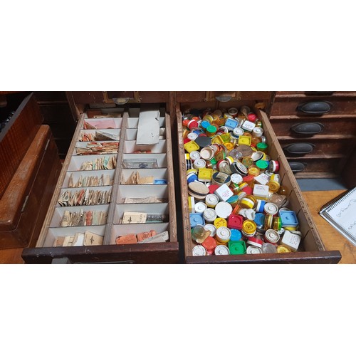 288 - A cabinet of assorted watch spares.