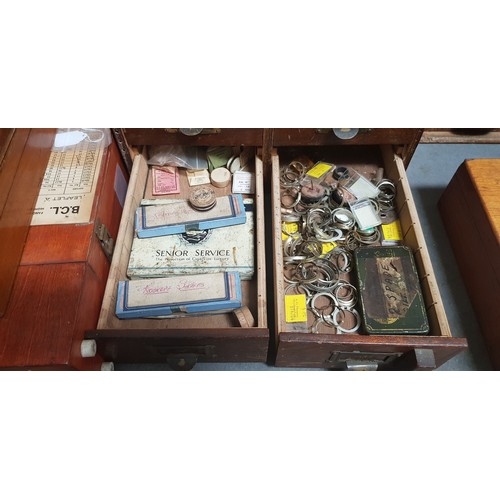 288 - A cabinet of assorted watch spares.