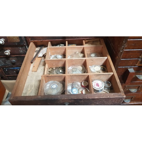 287 - A cabinet of assorted mainly vintage watch spares.