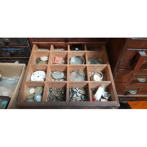 287 - A cabinet of assorted mainly vintage watch spares.