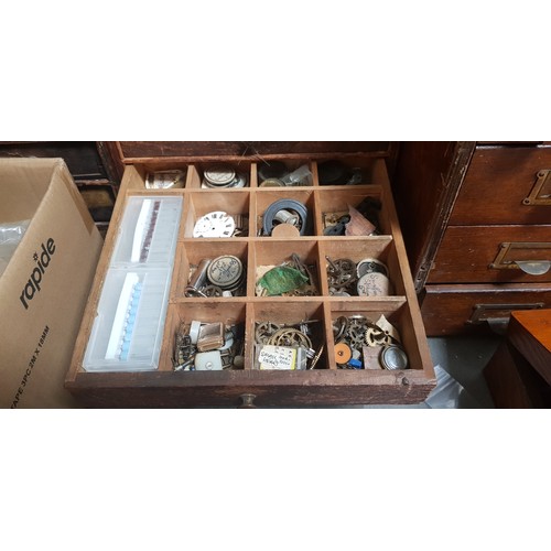 287 - A cabinet of assorted mainly vintage watch spares.