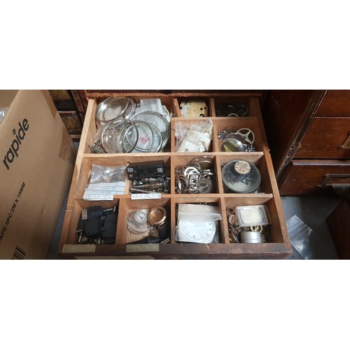 287 - A cabinet of assorted mainly vintage watch spares.