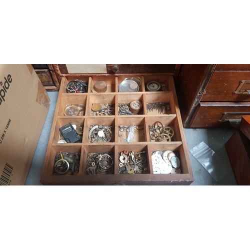 287 - A cabinet of assorted mainly vintage watch spares.