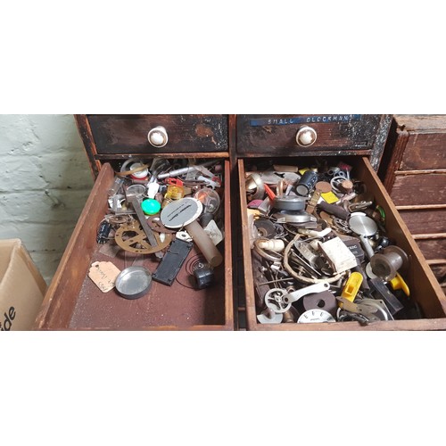 286 - A cabinet of assorted horology spares and tools.