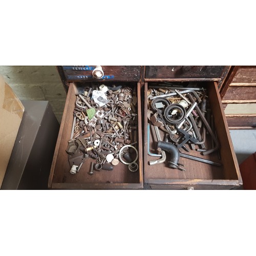 286 - A cabinet of assorted horology spares and tools.