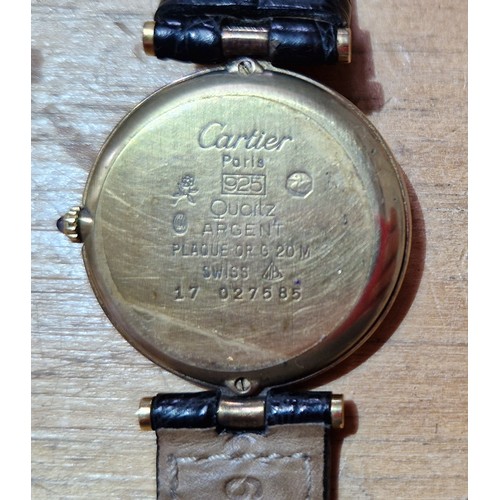 266 - A ladies silver gilt Cartier De Must wristwatch, case diameter 30mm.