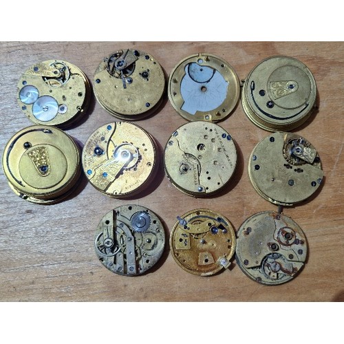 274 - A box of assorted pocket watch movements and dials.