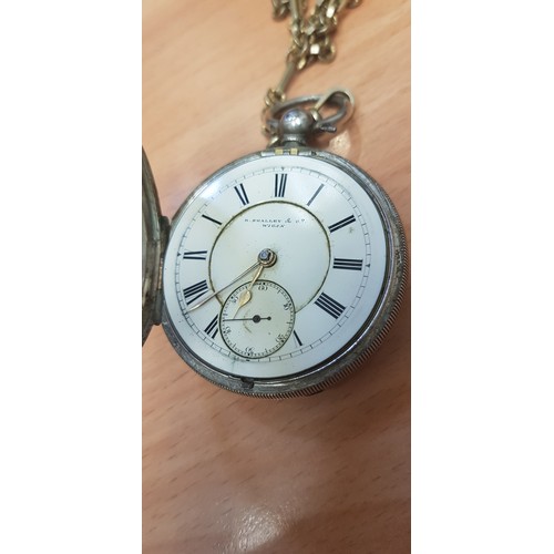 243 - Two hallmarked silver pocket watches with Albert chains.