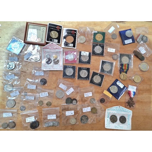 610 - A box of assorted coins and medals to include commemorative crowns & some silver etc.