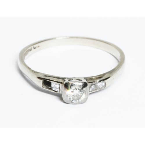 100L - An early 20th century diamond ring, the white metal band indistinctly marked '18ct', gross weight 2.... 