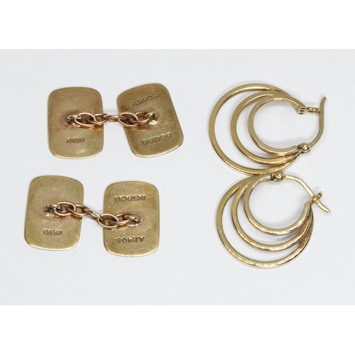 100E - A pair of hallmarked 9ct gold cufflinks and a pair of hoop earrings marked '375', gross weight 6.5g.