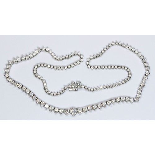 100B - A diamond rivière necklace, the graduated round brilliant cut stones weighing approximately 8 carats... 