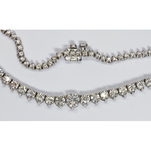 100B - A diamond rivière necklace, the graduated round brilliant cut stones weighing approximately 8 carats... 