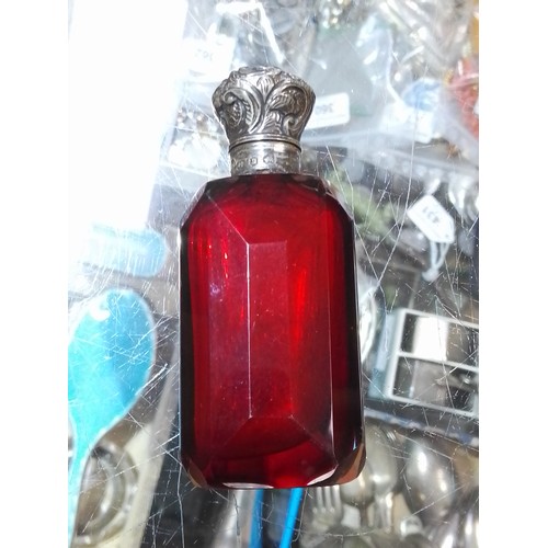 443 - Hallmarked silver comprising a red cut glass scent bottle with hallmarked silver top, length 8.5cm, ... 