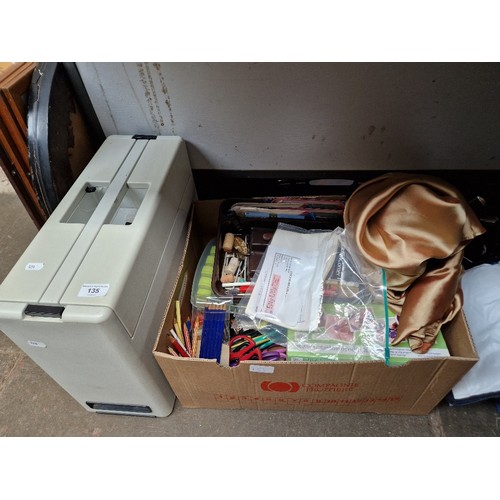 135 - A Pfaff 297 sewing machine and box of assorted haberdashery accessories.