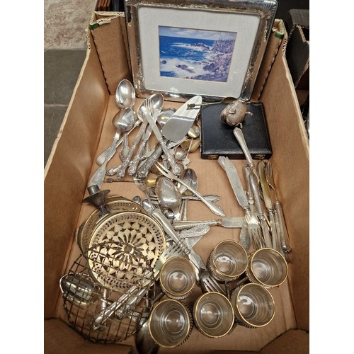 140 - A box of assorted silver and silver plated ware.