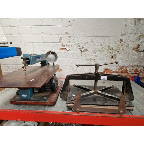 156 - A Draper fret saw and book press.