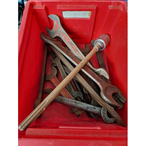 163 - A red box of assorted heavy duty spanners and a boring tool