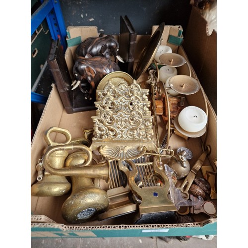 165 - A box of assorted mainly brass ware including weights and a letter rack.