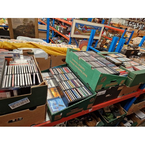 180 - Seven boxes of CDs and cassettes.