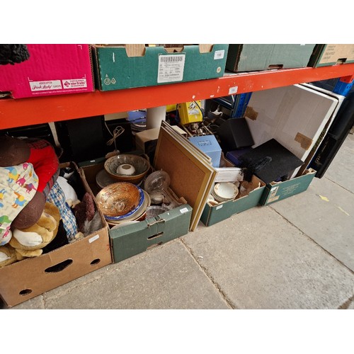 191 - Four boxes of assorted items comprising china and glass, soft toys, cutlery etc.