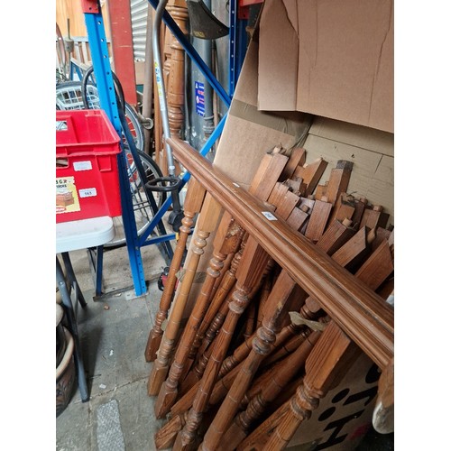 218 - Late Victorian/Edwardian pitch pine staircase banister, spindles and two newel posts.